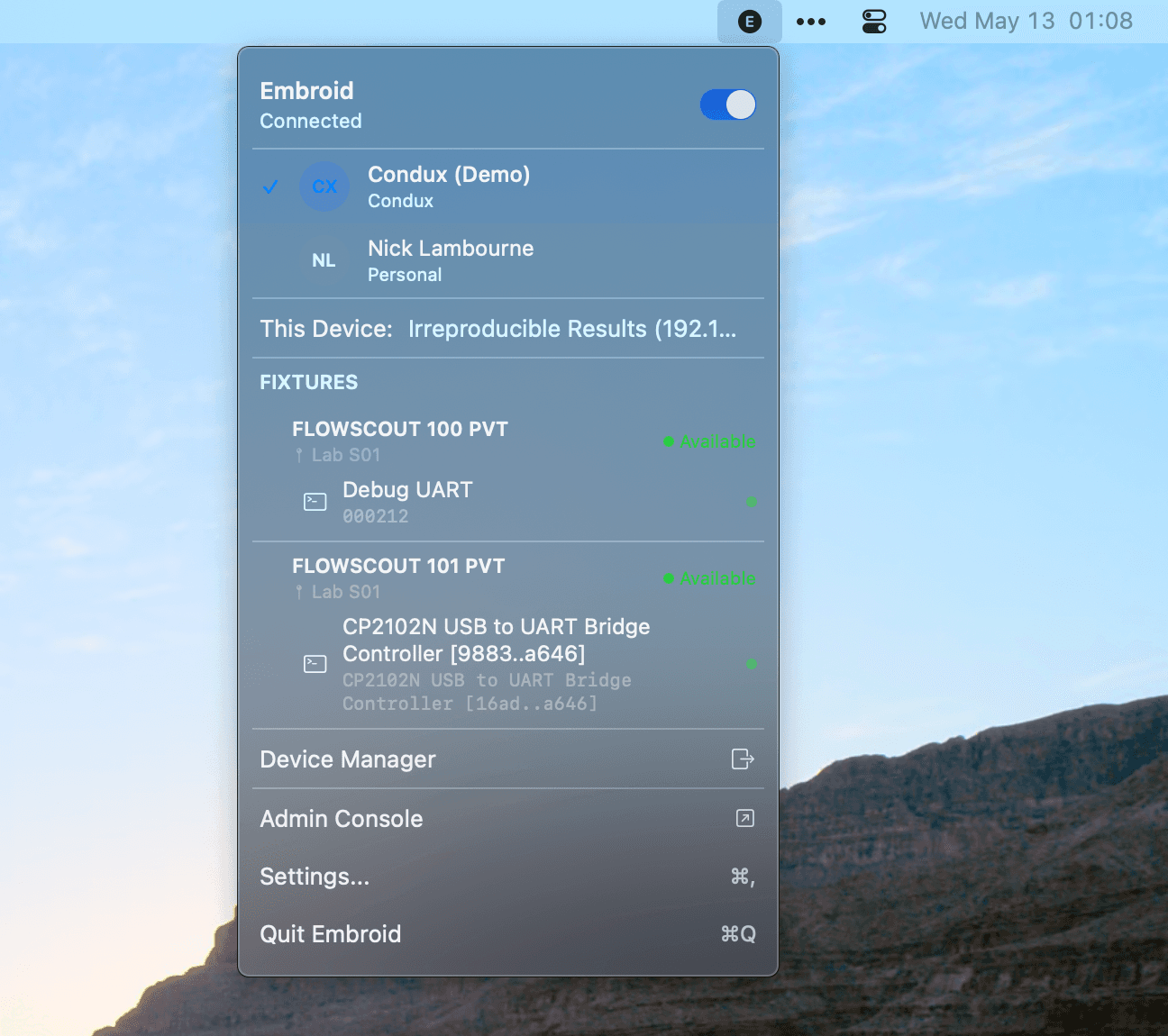 Embroid Client menu bar app on macOS — shows connection status, account, and discovered fixtures including FLOWSCOUT boards and a CP2102N USB-to-UART bridge.